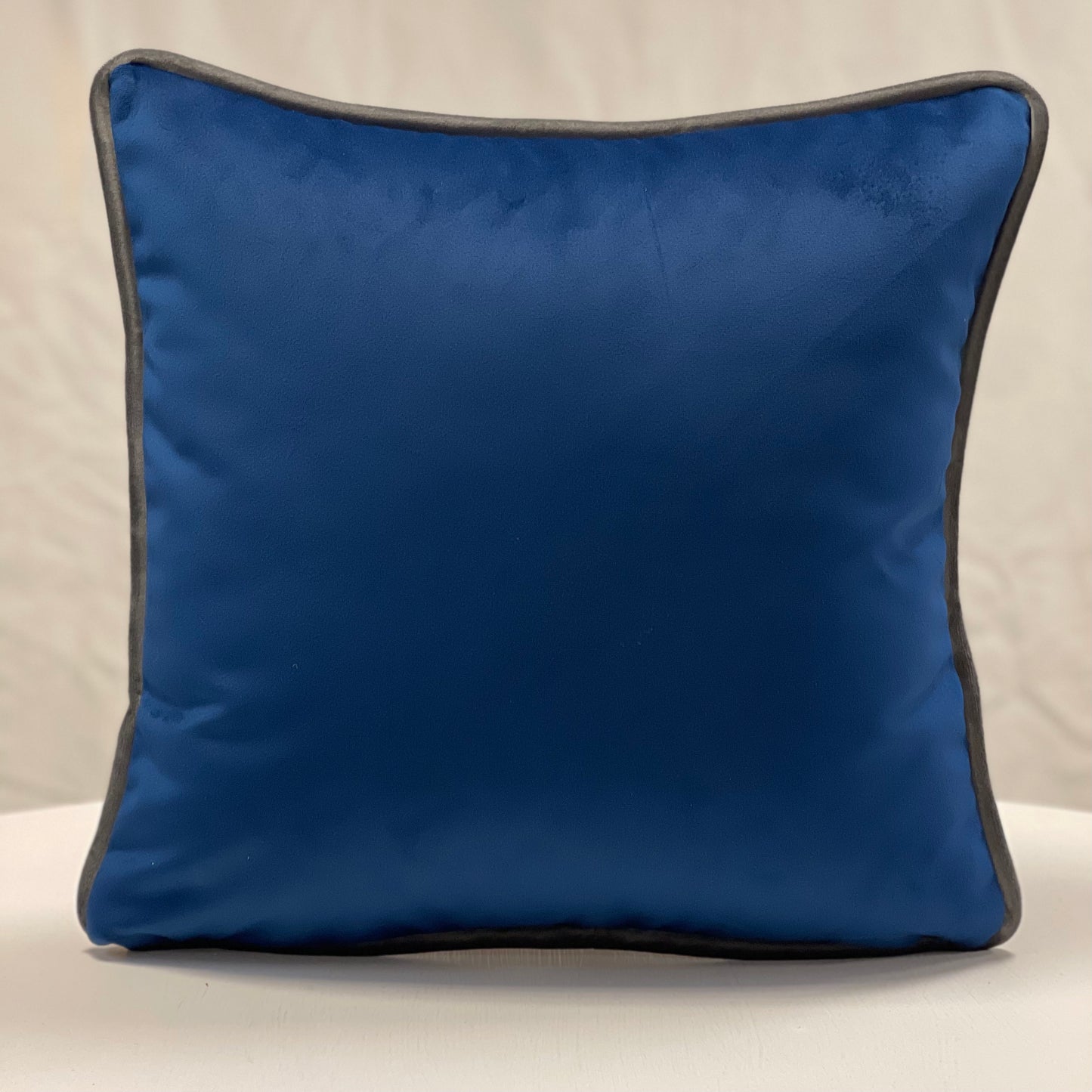 Blue velvet piped cushion