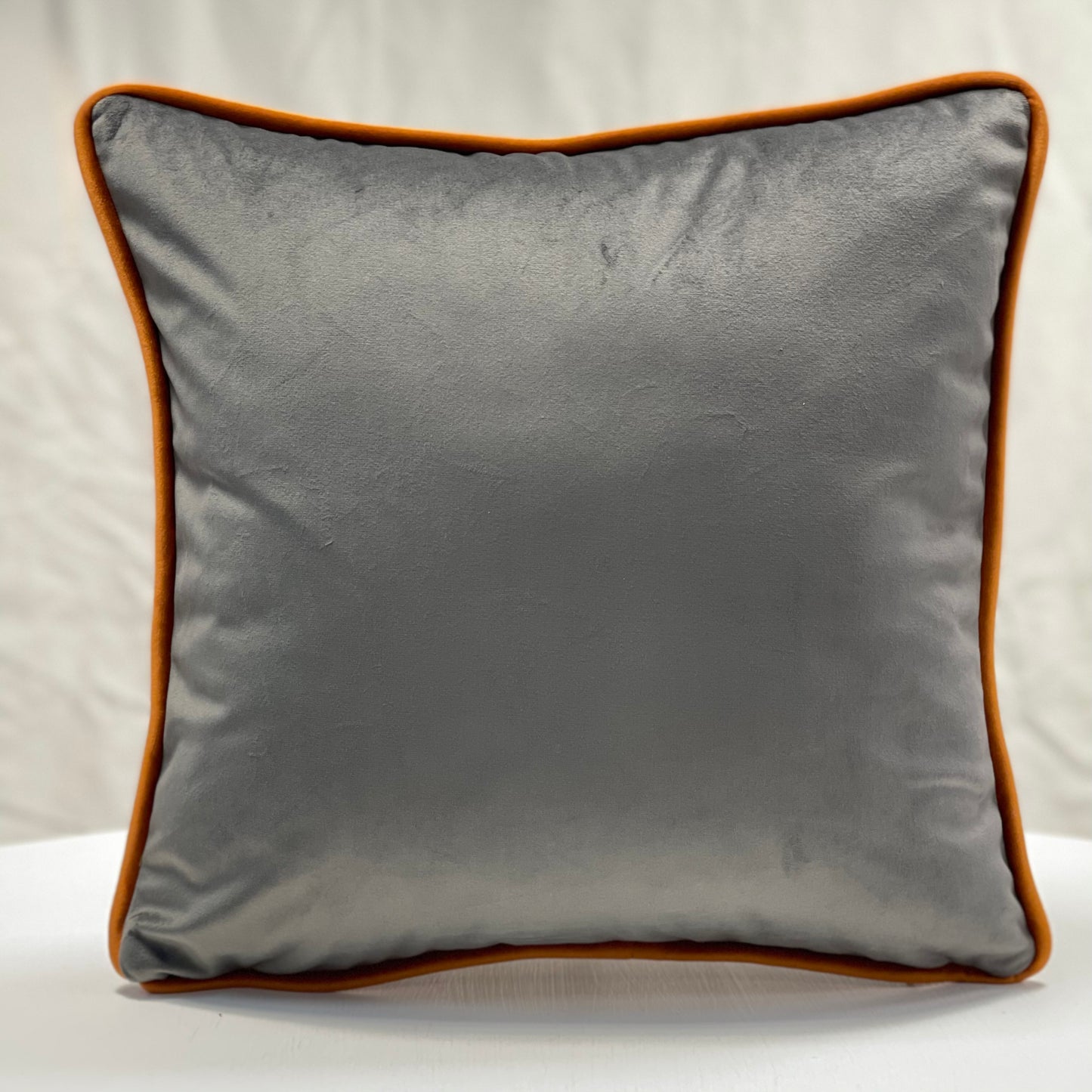 Grey velvet piped cushion