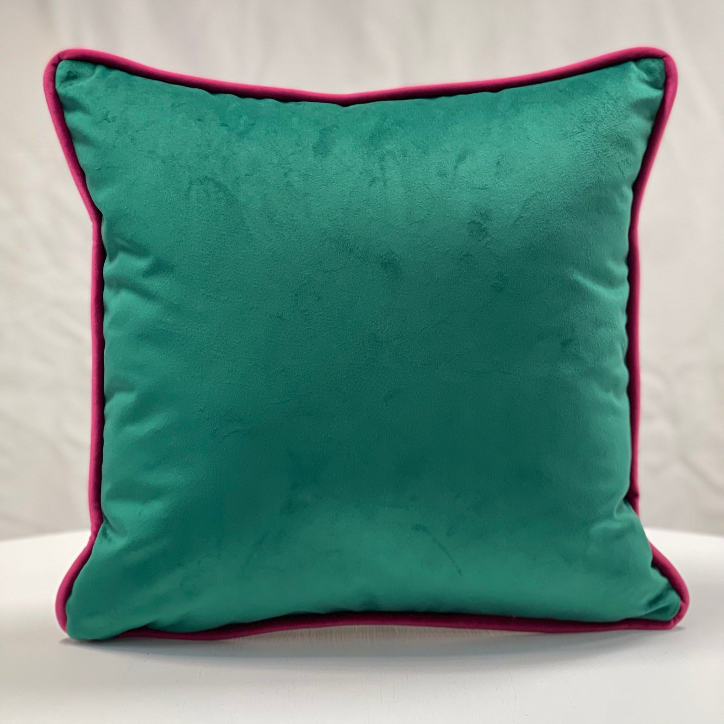 Emerald green velvet piped cushion