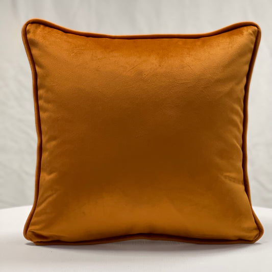 Orange velvet piped cushion